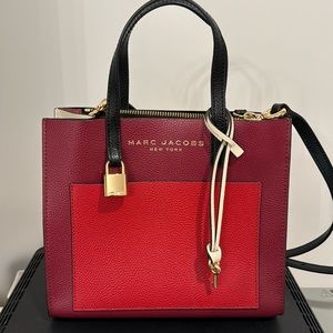 Marc Jacobs small tote with adjustable strap.